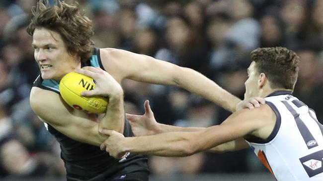 Port Adelaide’s Jared Polec pushes off GWS Giants’ Zac Langdon. Picture: SARAH REED