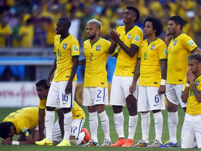 Brazil's players react during the penalty shootout after extra time in the round of 16 football match between Brazil and Chile at The Mineirao Stadium in Belo Horizonte during the 2014 FIFA World Cup on June 28, 2014. AFP PHOTO / FABRICE COFFRINI