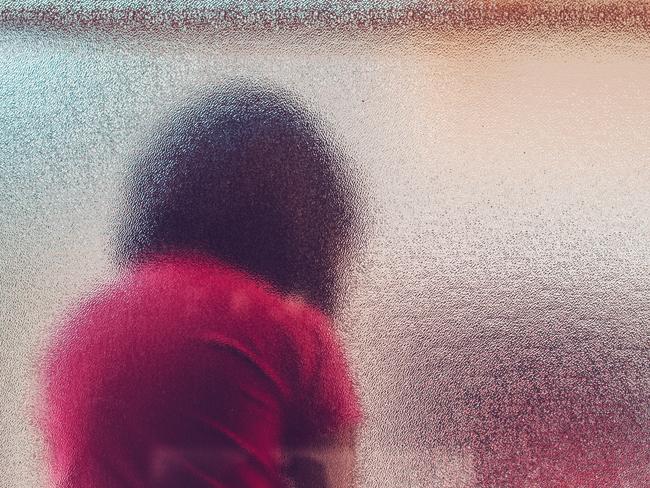 Silhouette of unrecognizable sad child. Generic iStock image.