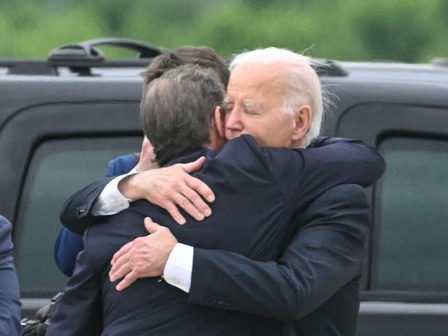 US President Joe Biden hugs his son Hunter Biden upon arrival at Delaware Air National Guard Base in New Castle, Delaware, after the guilty verdict. Picture: AFP