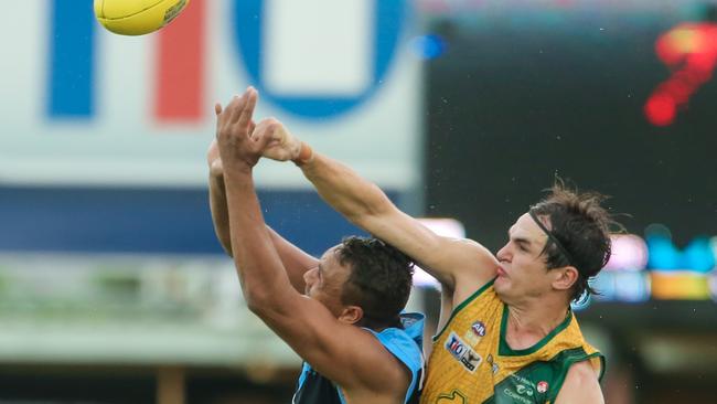 Buffalo Daniel Stafford is spoiled by St Mary’s defender Tom Davies during Saturday’s big game at TIO Stadium. Picture: GLENN CAMPBELL