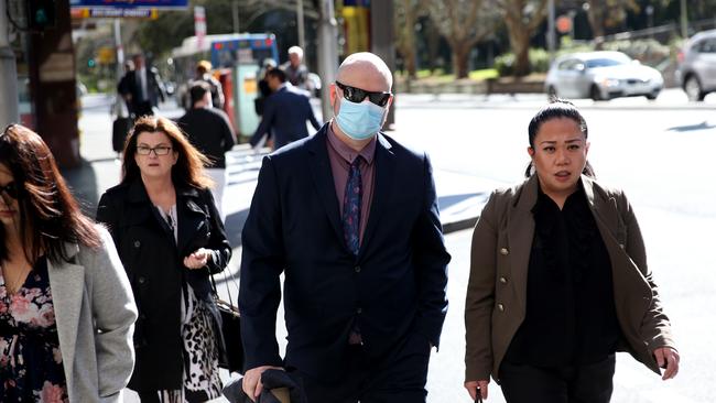 Daniel James Crawford (pictured centre wearing a mask and sun glasses) was sentenced to two years and nine months imprisonment with a non parole period of 16 months. Picture: NCA NewsWire / Damian Shaw