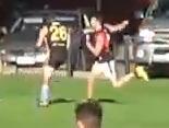 Tea Tree Gully footballer Ryan Spittle pictured striking Goodwood's SimonBrooks. Supplied.