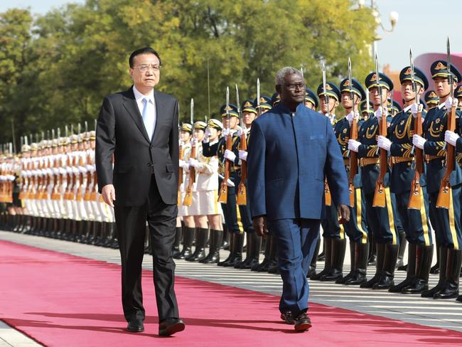 Chinese Premier Li Keqiang holds a welcoming ceremony for Solomon Islands' Prime Minister Manasseh Sogavare. Picture: Getty Images