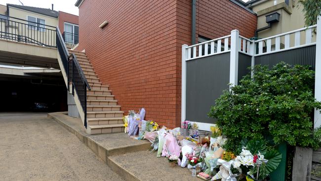 A memorial outside the apartment complex in Glen Waverley where a mother and her three children died in a house fire. Picture: NCA NewsWire / Andrew Henshaw