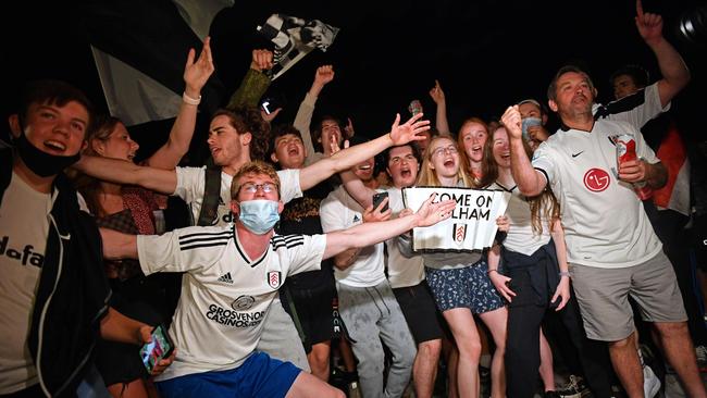 Fulham supporters gather outside Craven Cottage. Picture: AFP
