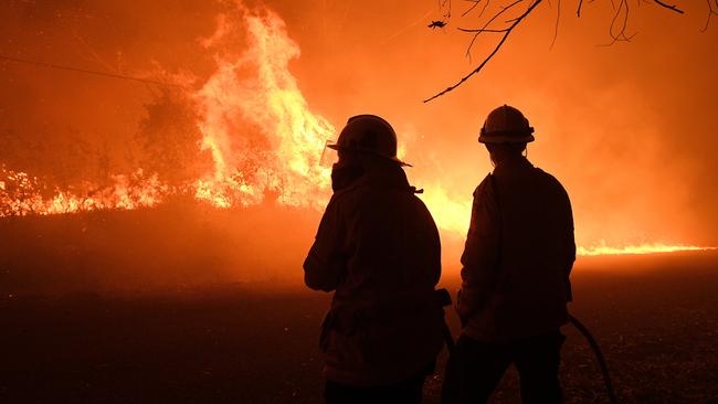 NSW Rural Fire Service crews protect properties on Kellyknack Road, Wrights Creek, NSW. Picture: AAP