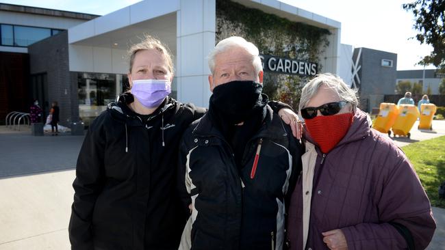 Veraneeka Jasinski with her parents John and Glenda outside Epping Gardens aged care home. The family is waiting for news on Veraneeka's grandfather who is a resident at the home. Picture: Andrew Henshaw