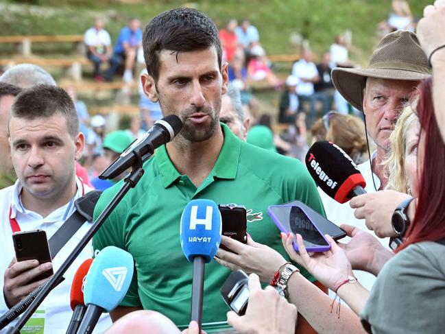 Serbian tennis player Novak Djokovic speaks to press after an exhibition match, organised to mark the opening of a tennis court at the "Archaeological park of the Bosnian pyramid" near Visoko, north of Sarajevo, on July 13, 2022. (Photo by ELVIS BARUKCIC / AFP)