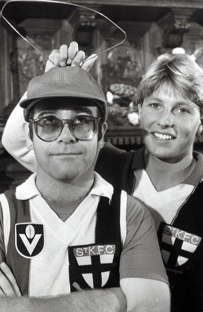 Elton John dons a St Kilda jumper in 1982.