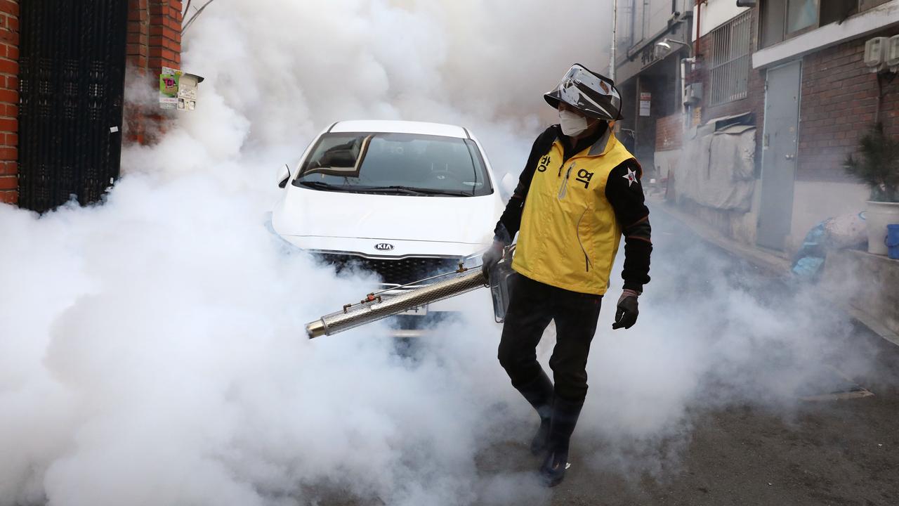 A worker disinfecting the streets of Seoul in South Korea trying to prevent a coronavirus second wave. Picture: Chung Sung-Jun/Getty Images.