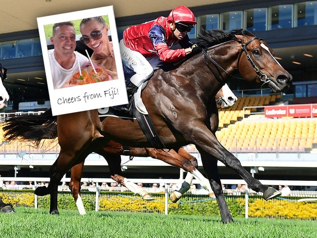 Trainer Tony Gollan and wife Jane share a toast in Fiji after Brereton's victory at Doomben on Saturday.