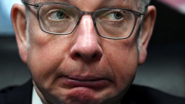 Michael Gove speaks to members of his team whilst travelling on the Conservative campaign bus in London last week. Picture: AFP