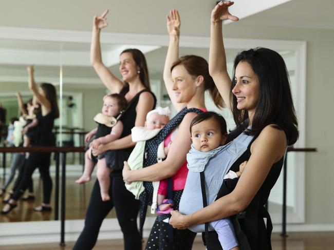 Natalie Bird Cassidy and Delphine, 11 months, Deirdre Harvey and Lily, 4 months, and Iman Davamoni and Almira, 11 months, doing the Xtend Barre workout in Coogee today. Picture: Justin Lloyd