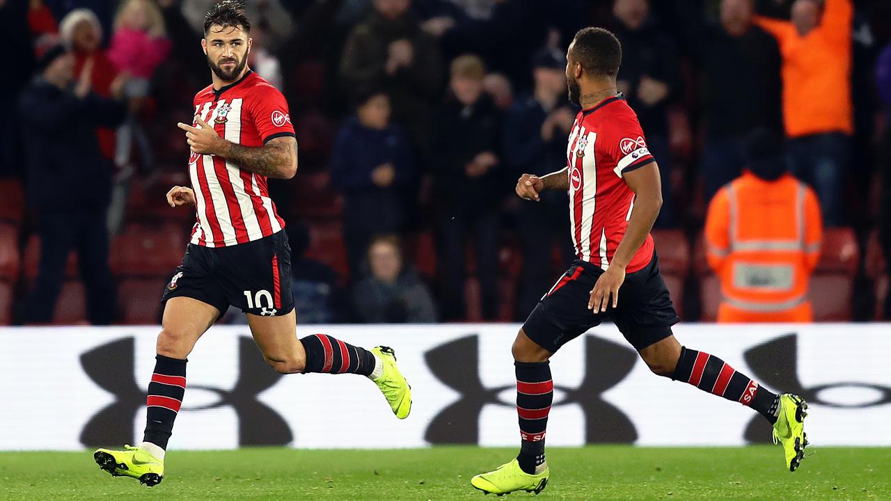 Charlie Austin of Southampton runs to the bench to celebrate a goal which was then disallowed