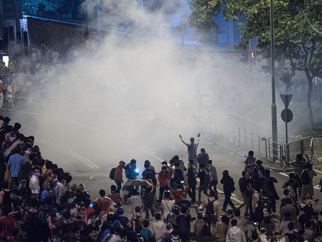Police fire tear gas into a crowd of demonstrators. Pic: Getty.