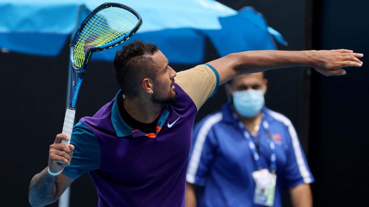 Australia's Nick Kyrgios throws his racket out of the court after smashing it. Picture: David Gray / AFP