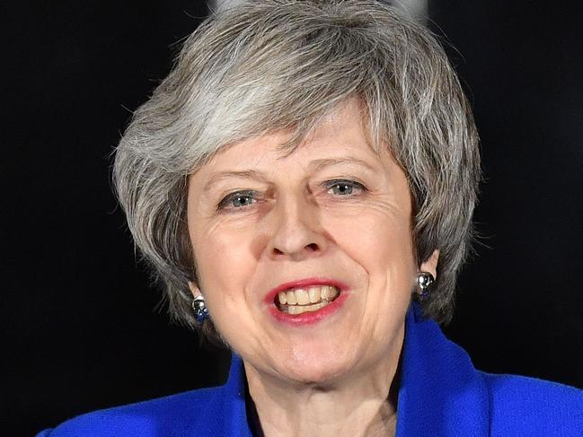 Britain's Prime Minister Theresa May delivers a statement to members of the media in Downing Street in London on January 16, 2019, after surviving a vote of no confidence in her government. - British Prime Minister Theresa May's government saw off a vote of no confidence in parliament on Wednesday, called after MPs overwhelmingly rejected the Brexit deal. (Photo by Ben STANSALL / AFP)