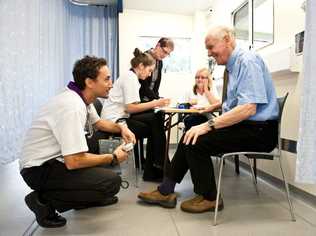 SCU Exercise Physiology student Sam Mitchell talks to expert Patient Peter Patton in the spacious SCU Learning & Research Facility super trailer. Picture: Rob Wright