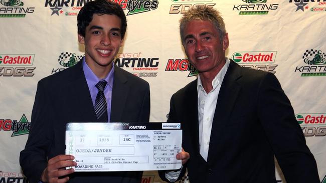 Jayden Ojeda accepting his boarding pass as a part of Team Australia for the 2015 CIK-FIA Winter Cup from Karting Australia Chairman Mick Doohan (Pic: Coopers Photography)