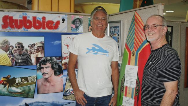 Talking about the future direction of Surf World Gold Coast are new patron and 1980 Stubbies winner Peter Harris and chairman Rob Ryan in front of the Stubbies exhibit which is now on permanent display.