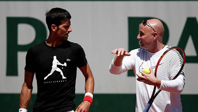 Novak Djokovic of Serbia and his coach Andre Agassi during a training session. Photo: Reuters