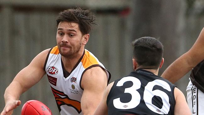 Jesse Davies of Craigieburn (left) under pressure from Steven Mete of West Coburg during EDFL footy: West Coburg v Craigieburn on Saturday, July 27, 2019, in West Coburg, Victoria, Australia. Picture: Hamish Blair