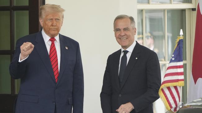 Canadian Prime Minister Mark Carney is greeted by President Donald Trump as he arrives at the West Wing of the White House, Tuesday, May 6, 2025, in Washington. (AP Photo/Mark Schiefelbein)