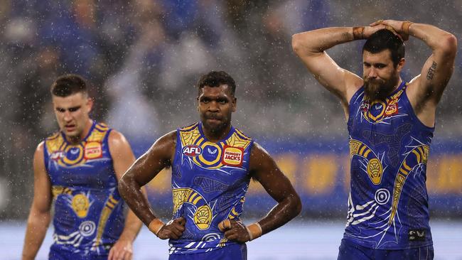 It was another tough night for Eagles players Elliot Yeo, Liam Ryan and Josh Kennedy. Picture: Paul Kane/Getty Images)