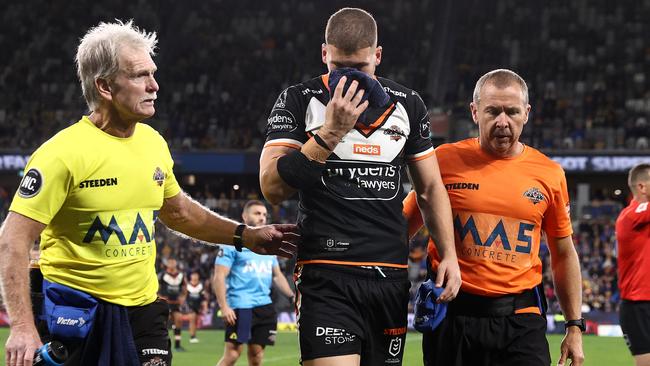 SYDNEY, AUSTRALIA - JUNE 13: Adam Doueihi of the Tigers leaves the field after a high tackle from Maika Sivo of the Eels during the round 14 NRL match between the Parramatta Eels and the Wests Tigers at Bankwest Stadium, on June 13, 2021, in Sydney, Australia. (Photo by Cameron Spencer/Getty Images)