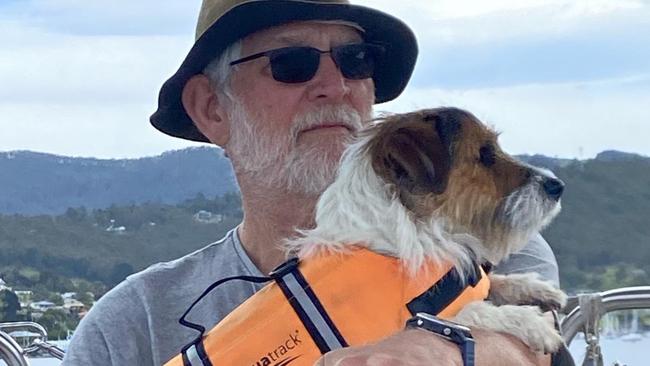 Professor Dennis Pashen with his dog Toby cruises the Channel area in Hobart.