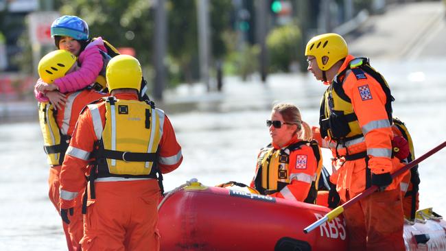 MELBOURNE, AUSTRALIA - OCTOBER 14TH, 2022: Maribyrnong Floods, Melbourne. Little girl being rescued by the SES at Raleigh Rd.Picture: Nicki Connolly