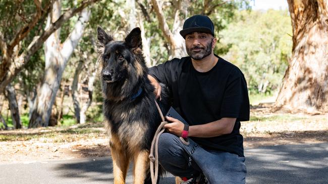 Knuckles the German Shepherd with owner Wael, who helped to save a young girl who had almost drowned in the water in the River Torrens on Friday, February 16. Picture: Morgan Sette.