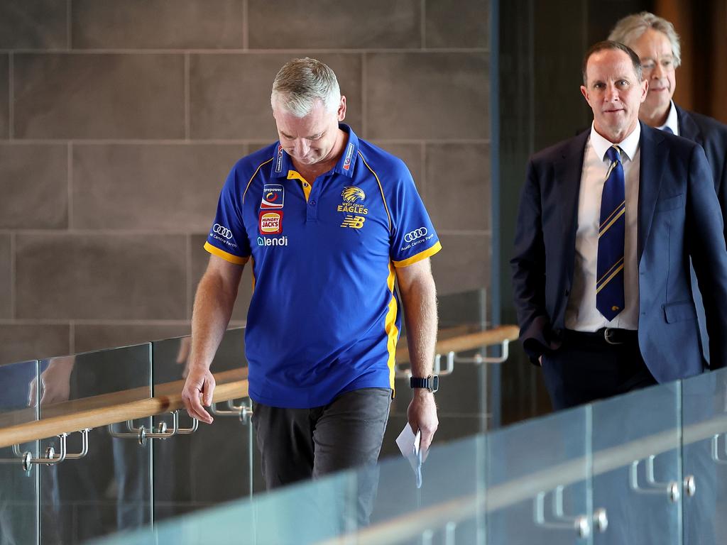 Adam Simpson walks to a press conference with Don Pyke (CEO) and Paul Fitzpatrick (Chairman) after Simpson and the club agreed to part ways. Picture: Paul Kane/Getty Images.