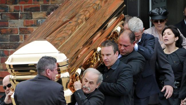 Roberta Williams leaves the church behind Carl’s coffin.