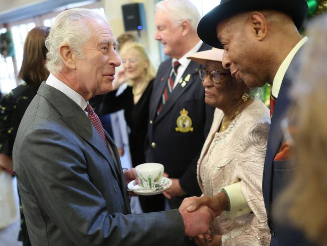 King Charles III's shakes hands with a guest, including local residents who have been nominated by friends, family and organisations also turning 75. Picture: Getty Images