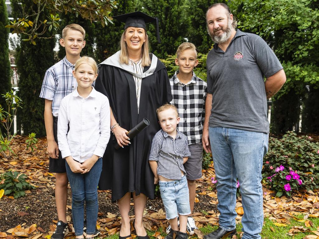 Master of Business and Master of Professional Accounting graduate Melissa Rogers with family (from left) Ryan Ballini, Imogen Ballini, Cole Rogers, Cooper Ballini and Craig Rogers at the UniSQ graduation ceremony at Empire Theatres, Tuesday, December 13, 2022. Picture: Kevin Farmer