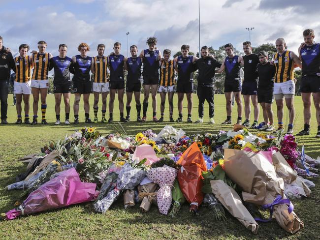 After playing a match nearby, footballers from Melbourne University Blacks and St Bernards walked over to pay their respects to Eurydice Dixon. Picture: Wayne Taylor