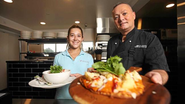 North Kirra Surf Life Saving Club head Chef Bernie Powling and staff member Brianna Buvnett. Picture: Scott Powick