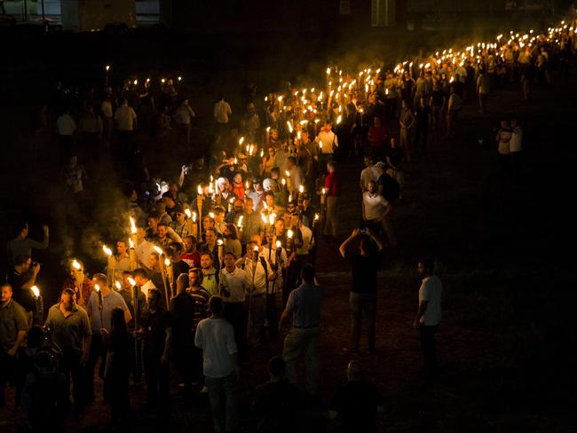 Neo Nazis, Alt-Right, and White Supremacists march through the University of Virginia Campus. Picture: Samuel Corum/Anadolu Agency/Getty Images