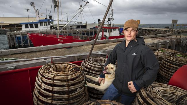 Third generation crayfisherman Steve Hursey and his dog Gus at Stanley. PICTURE CHRIS KIDD