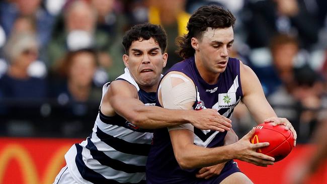 Former Cat Jordan Clark is tackled by Tyson Stengle early in the 2022 season. Picture: Dylan Burns/AFL Photos via Getty Images.