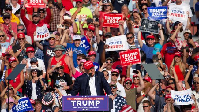 TOPSHOT - Former US President and Republican presidential candidate Donald Trump speaks during a campaign event at Butler Farm Show Inc. in Butler, Pennsylvania, July 13, 2024. Donald Trump was hit in the ear in an apparent assassination attempt by a gunman at a campaign rally on Saturday, in a chaotic and shocking incident that will fuel fears of instability ahead of the 2024 US presidential election. (Photo by Rebecca DROKE / AFP)