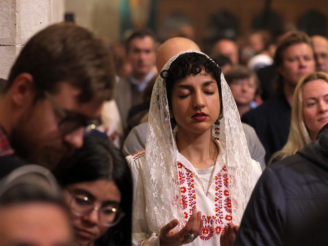 Worshippers pray during the Christmas midnight Mass at the Catholic Church of Saint Catherine, in the Nativity Church Complex, in the biblical city of Bethlehem in the occupied West Bank on December 25, 2024. Picture: AFP