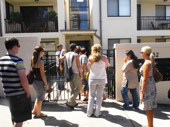 Rent crisis - about 25 people in rental market queue to inspect a one bedroom apartment in Clovelly. Chahaija Hunter inspects the home