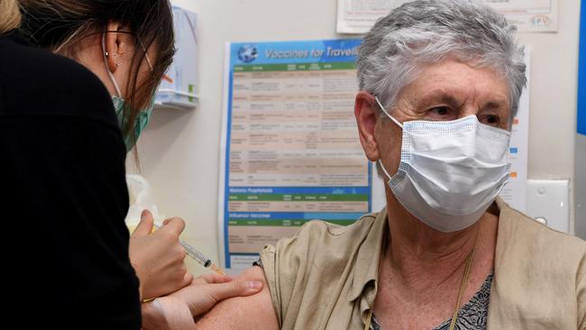 Anne Hyslop, right, receives an AstraZeneca vaccine from practice nurse Youri Park, left, in Melbourne. Picture: AFP.