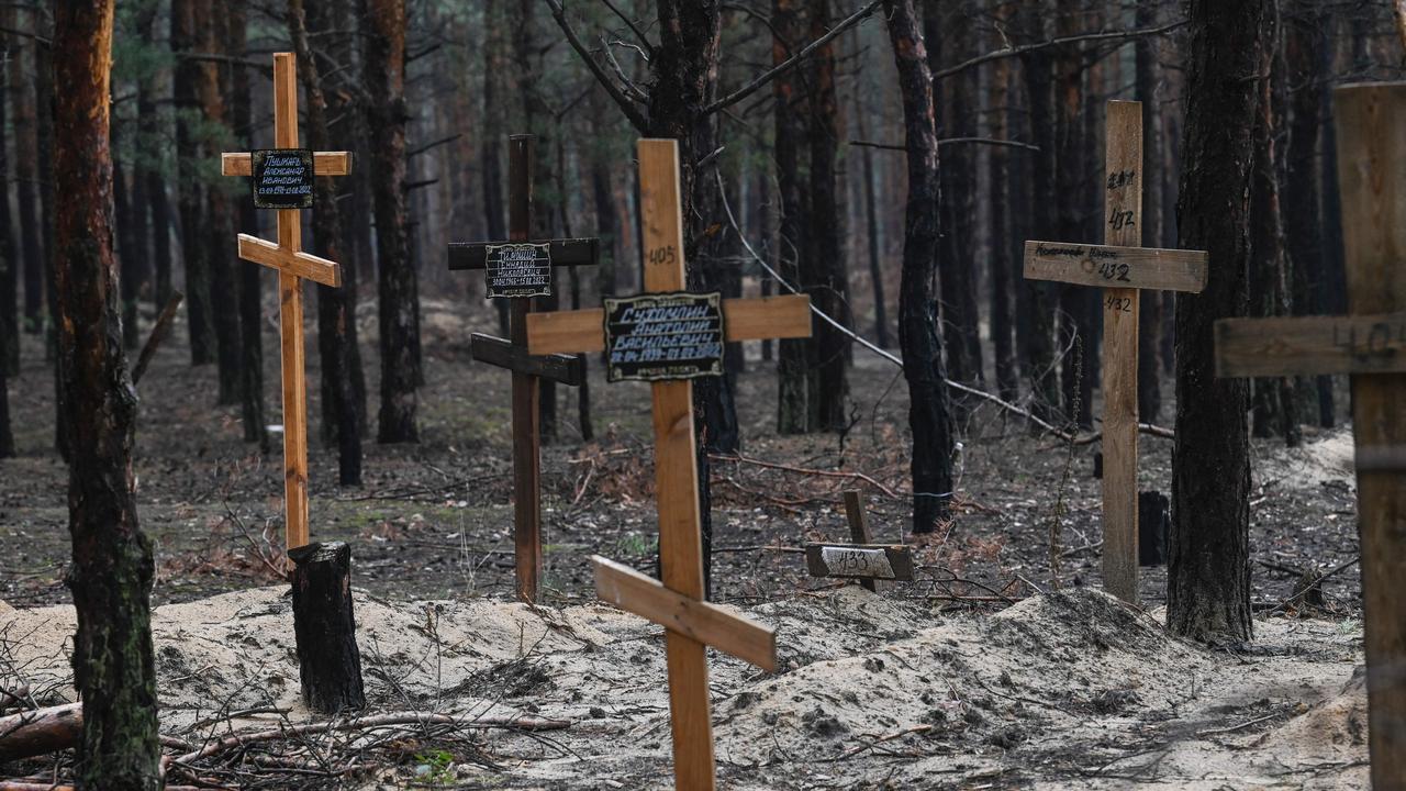 Ukraine officials say they have counted more than 450 graves at just one burial site. Picture: Juan Barreto/ AFP.