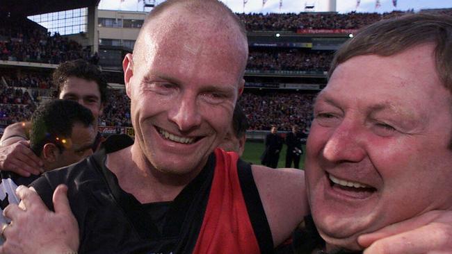 Dean Wallis celebrates the 2000 premiership with Kevin Sheedy.