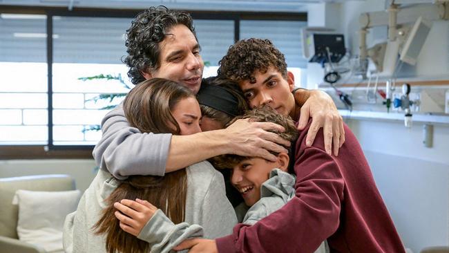 Released Israeli hostage Ofer Kalderon reunited with his children at Sheba hospital in Ramat Gan on Saturday. Picture: Maayan Toaf / Israeli Government Press Office / AFP