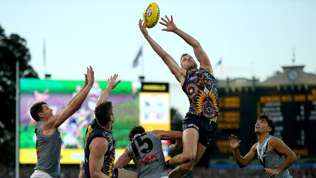 ADELAIDE, AUSTRALIA — JULY 06: Brodie Smith of the Crows flies during the 2019 AFL round 16 match between the Adelaide Crows and the Port Adelaide Power at the Adelaide Oval on July 06, 2019 in Adelaide, Australia. (Photo by James Elsby/AFL Photos via Getty Images)